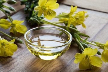 Obraz na płótnie Canvas Evening primrose oil in a glass bowl