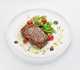 Marble stake with spicy herbs and sea salt over white  background