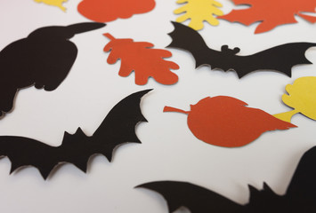 The halloween symbols are cut from paper. House decoration for Halloween.