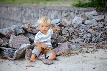 Cute boy with blond hair and blue eyes