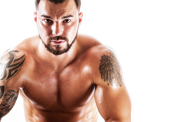 Fototapeta premium Studio shot of athletic young man posing shirtless