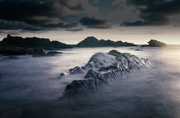 Bude, Cornwall, United Kingdom at sunset, beautiful seascape, sea crashing against rocks