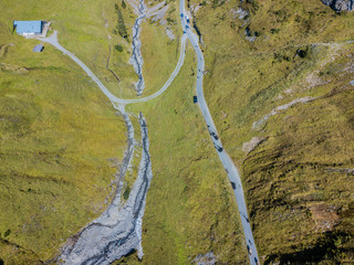 Aerial view of road crossing a river in Swiss mountains