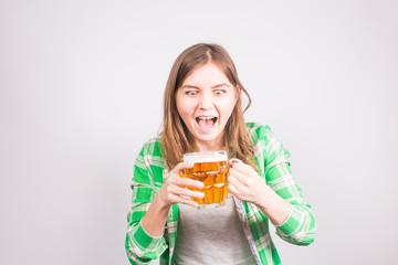 Emotional fan with a beer. Woman with a mug of beer