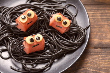 Fototapeta na wymiar Sausage and spaghetti funny spiders for kids