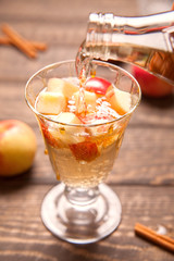 Apple cider cocktail with cinnamon and apple
