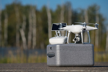 quadcopter drone with 4K video and photo camera for aerial photography outdoors with selective focus effect