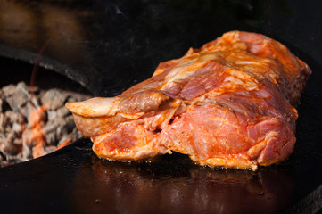 delicious beef steak and corn on the grill with flames