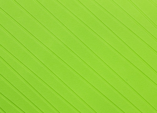 A plastic mat with a green paint