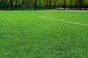 football field with artificial turf, angle, background