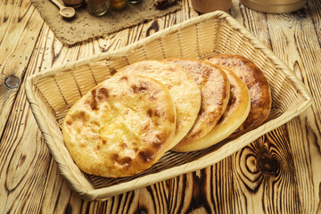 Traditional Georgian bread - khachapuri and Kolkh khachapuri on the table.Homemade baking. Flat lay, overhead.Khachapuri with cheese,georgian khachapuri megruli with cheese,Traditional Georgian pie