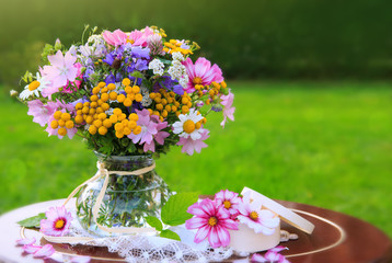 Bouquet colorful wild flowers . Holiday card.