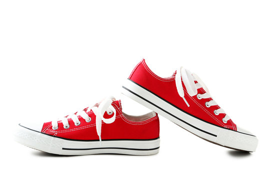 Pair of red sneakers isolated on a white