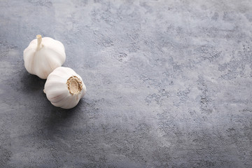 Garlic on the grey wooden table