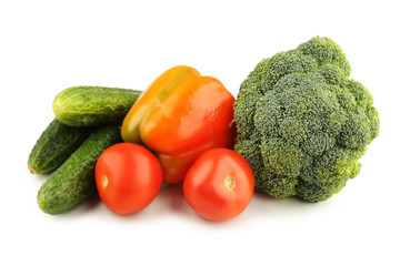 Ripe pepper, broccoli, cucumbers and tomatoes isolated on white background