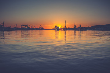 Amazing foggy sunrise over the shipyard in Gdynia