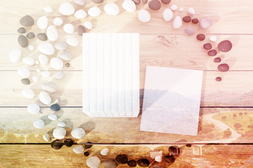 Stack of books lying on a wooden table toned
