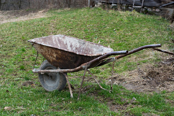 Old and well used rusty wheelbarrow