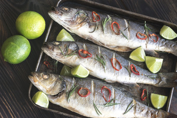Baked sea bass with lime and chilli pepper