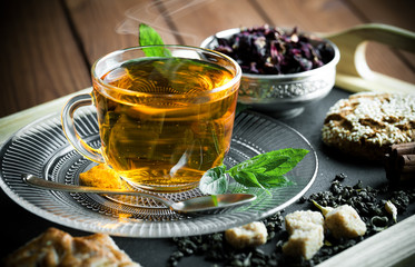 Tea in a cup on an old background