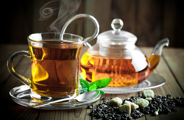 Tea in a cup on an old background