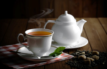 Tea in a cup on an old background