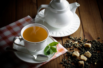 Tea in a cup on an old background