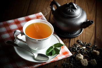 Tea in a cup on an old background