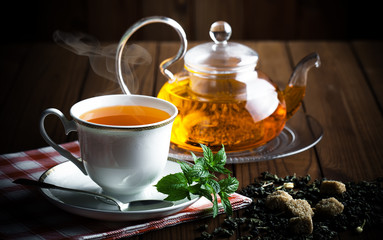 Tea in a cup on an old background