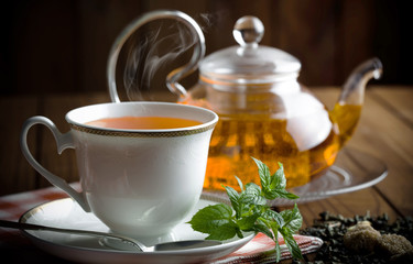 Tea in a cup on an old background