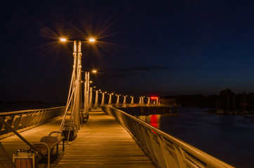 Pier in the night with promenade in the night, Plock, Poland