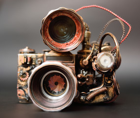 Fototapeta na wymiar futuristic steampunk camera on a dark background close up