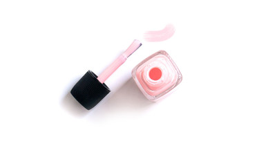 glamorous pink nail Polish on white isolated background