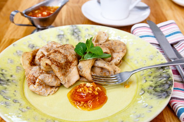 Russian pancakes with jam are on the plate. Breakfast