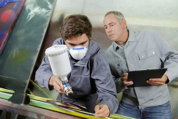 grading the spray painting process