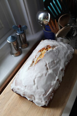 Home-made cake, glazed with sugar on kitchen table