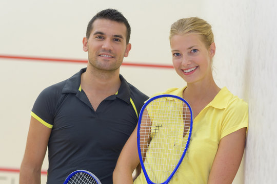 squash player couple posing