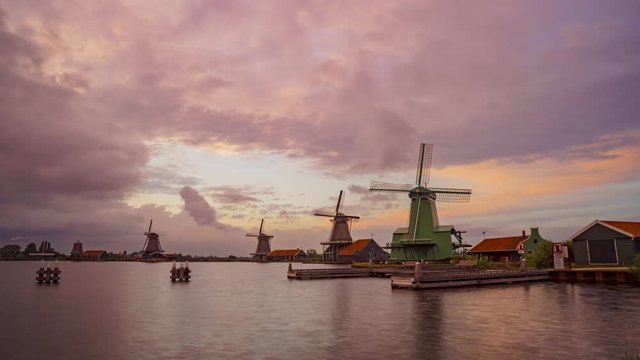 Up motion timelapse of typical Dutch windmills at sunset, Zaanse Schans, Netherlands