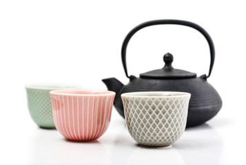 Green tea in cast-iron teapot