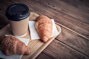 Two croissants and coffee-to-go