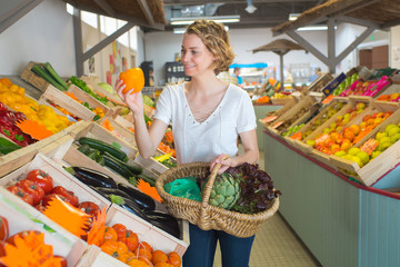 young woman customer in fruit store