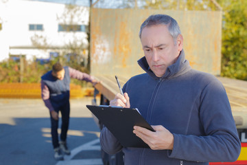 worker inspecting the empty truck