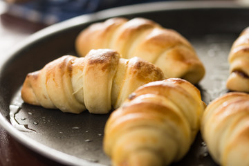 Closeup macro of baked rolls on the baking tray with selective focus