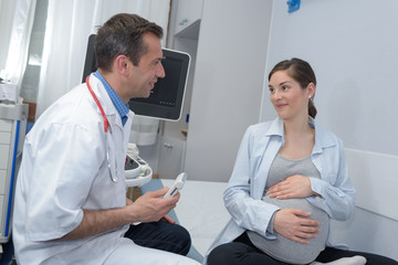 pregnant woman with doctor at hospital
