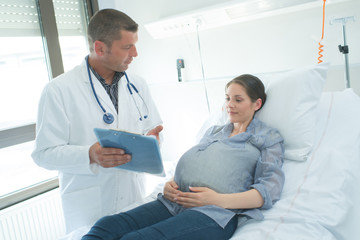 pregnant woman with doctor at hospital