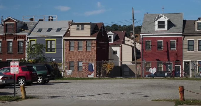 An establishing shot of typical row houses in Pittsburgh's South Side district.  	