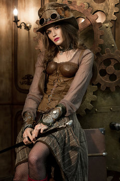 Beautiful girl, model in the style of a steampunk in a beautiful creative studio. Fashion, style, beauty.