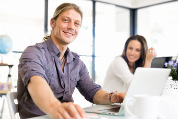 Handsome businessman working at computer