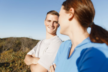 Obraz premium Young couple on beach training together