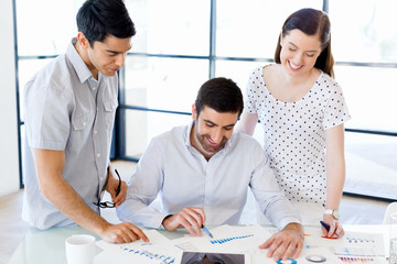 Fototapeta premium Group of happy young business people in a meeting